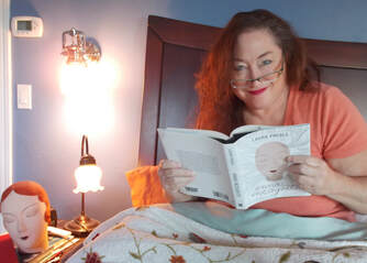 Author Laura Preble in bed